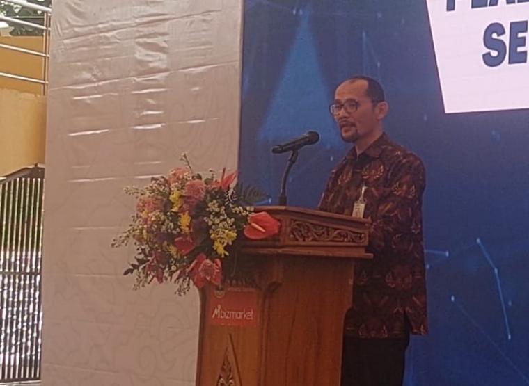 Direktur Perencanaan Transformasi, Pemantauan dan Evaluasi Pengadaan LKPP, Fadil Arif saat sambutan di acara Temu Bisnis dan Sosialisasi Mbiztravel di Plazza Aspirasi. (Foto: TitikNOL)